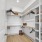 Spacious walk in closets with built in shelves