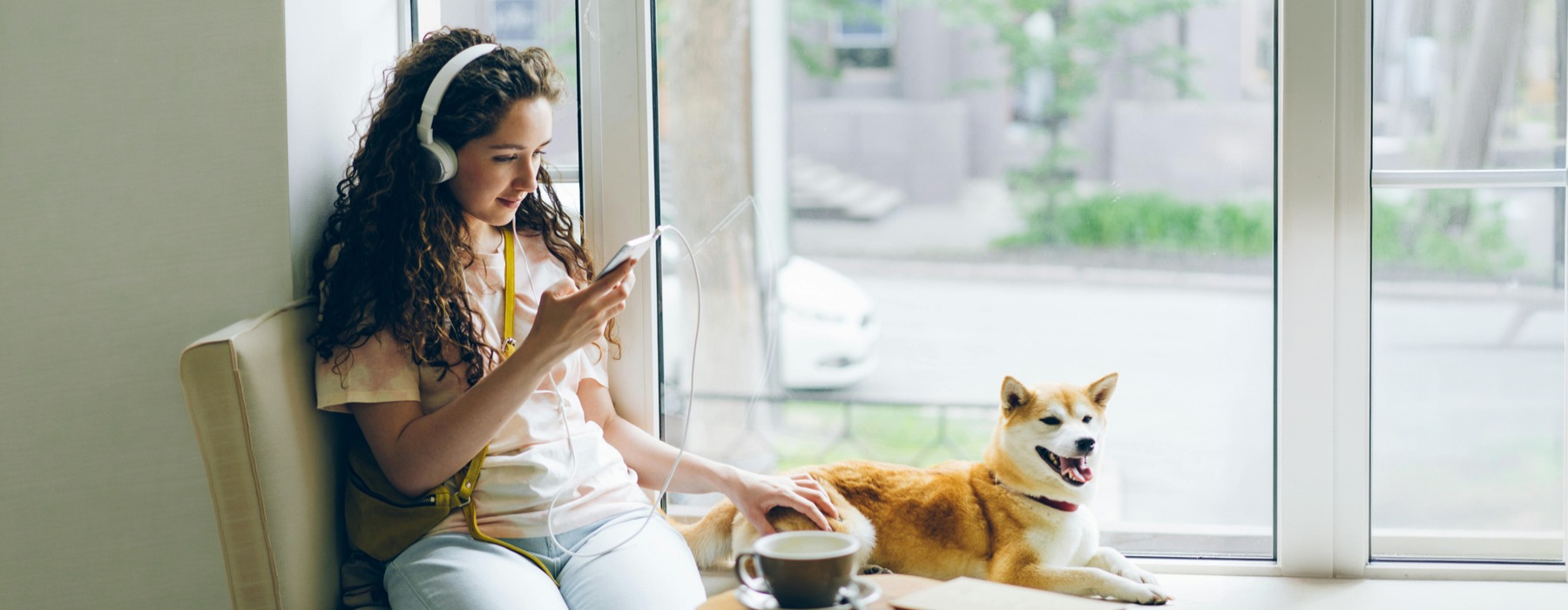 a woman and a dog indoors