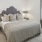 Bedroom with natural lighting and high ceilings